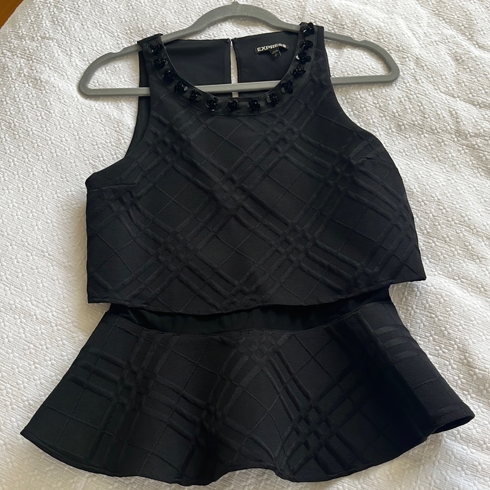 Black peplum tank with beautifully embellished neckline